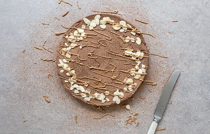 Raw Chocolate Cake with Almond Frosting Thrive Health & Nutrition Magazine